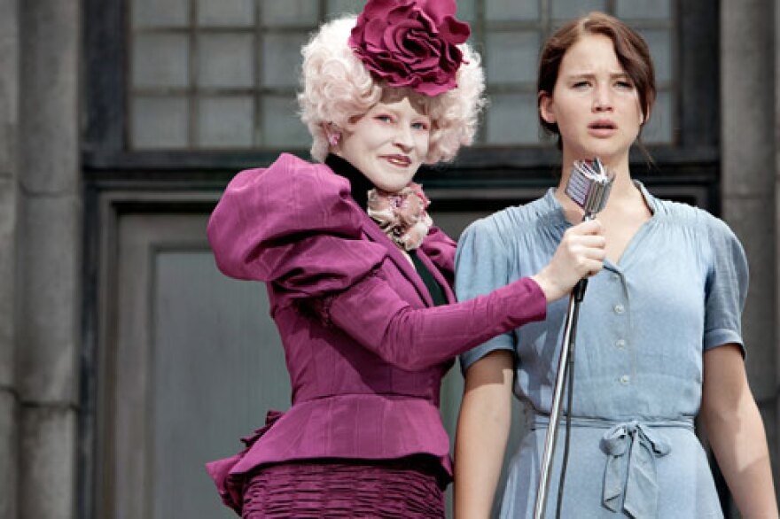 The Reaping scene featuring Effie Trinket (Elizabeth Banks, left) and Katniss Everdeen (Jennifer Lawrence) was filmed near