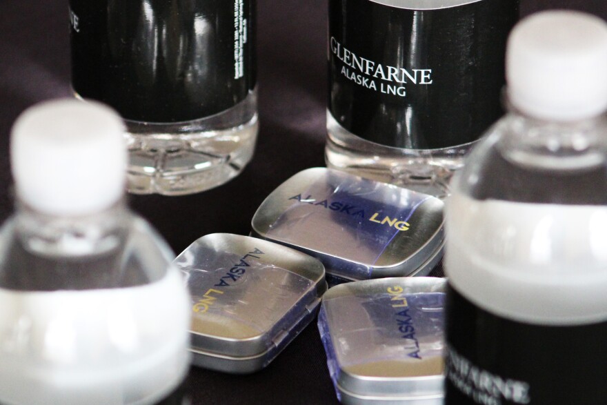 Alaska LNG branded water bottles and mint tins rest on tables at an event hosted by Glenfarne Group on Monday, May 18, 2026 in Nikiski, Alaska.