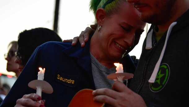 Saundra Thrasher broke down at the vigil for victims of the UPS plane crash in Louisville. She was leaving work at the company Tuesday when it occurred and rushed back to the area.