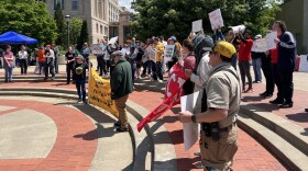 A group of about 50 people protests at Speaker's Circle on the University of Missouri campus on May Day -- May 1, 2026.
