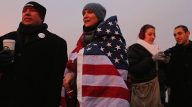People gather near the U.S. Capitol for the inauguration ceremony on Monday.