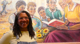 Kansas Historical Society curator Donna Rae Pearson in front of the Broad v. Board of Education mural in Topeka, KS. She is also the co-owner of Other Roads Consulting, Inc.