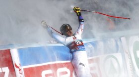 United States' River Radamus celebrates as after crossing the finish line during an alpine ski, men's World Cup giant slalom, in Soelden, Austria, Sunday, Oct. 24, 2021. (AP Photo/Marco Trovati)