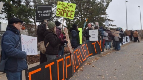 About 70 protesters urged travellers to boycott Avelo at Manchester-Boston Regional Airport on Sunday, Nov. 23, 2025. This is part of ongoing public backlash for a contract the airline signed to operate flights with immigration detainees.