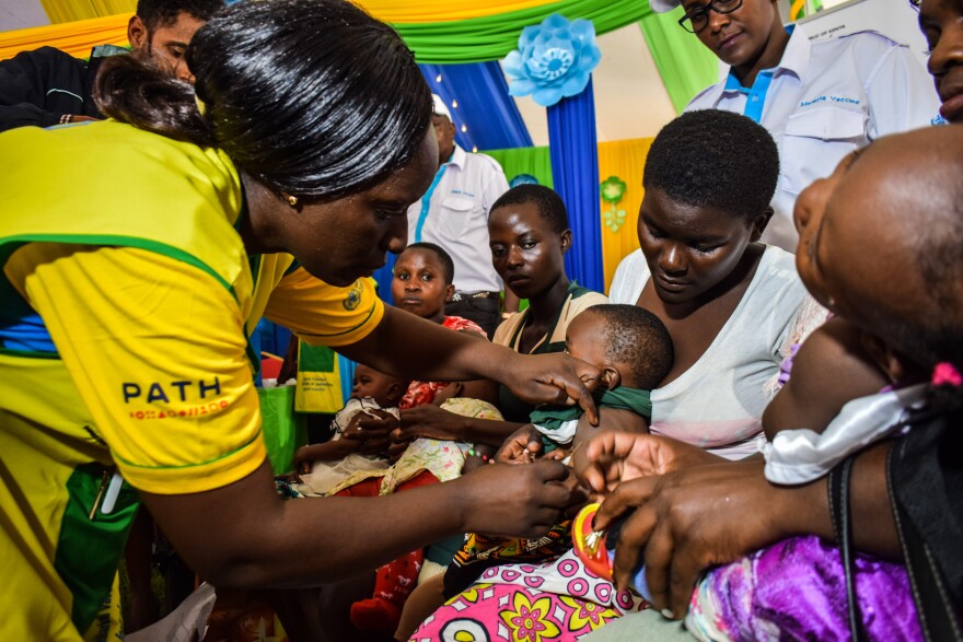 Children face many dangers, say humanitarian workers, but their plight is often overlooked. For example, more than 1,300 children die of malaria each day. Above: A health worker vaccinates a child against malaria in Kenya.