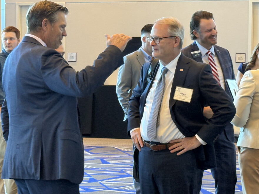 Kobach chats with Democratic U.S. Senate candidate Adam Hamilton before an Olathe event talking to business leaders