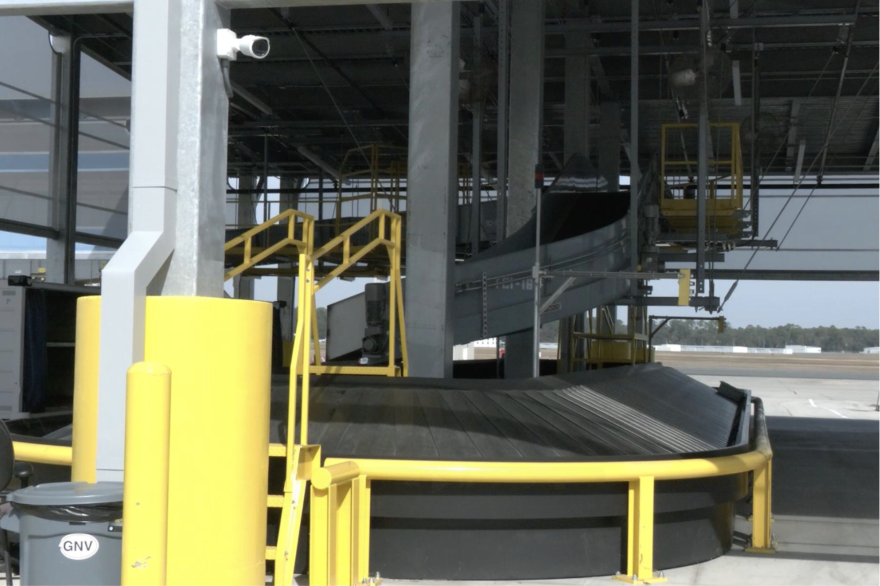 The first phase of the outbound baggage system sits in front of the current commercial apron. The airport is continuing to expand its baggage-handling methods. (Stryker Anderson/WUFT News)