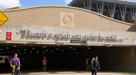 Students walk through a tunnel under Wellborn Road on the Texas A&M University campus in College Station on Nov. 13, 2025.