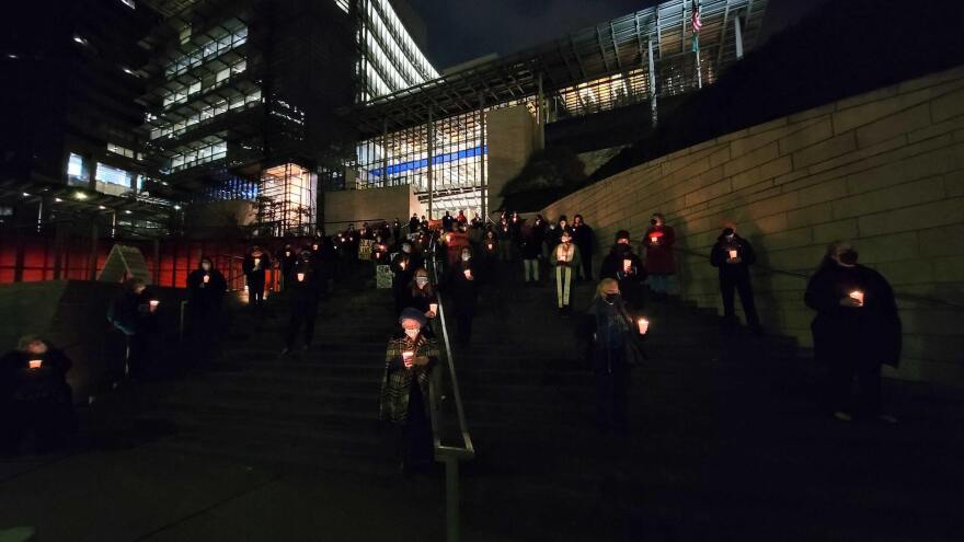 People gathered at Seattle City Hall on December 21, 2021 to remember homeless people who died in the past year.