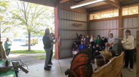 Fourth-graders from Anne DeMarco's class learn about tree health from Service Forester Julian Maza.