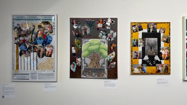 The photo depicts three collages side-by-side on display at the exhibition titled "Living and Loving Under the Carceral State" at King Street Station. The artist used photos of her brother and his children for the pieces. One includes a drawing of a tree with its roots growing in a concrete-like structure. 