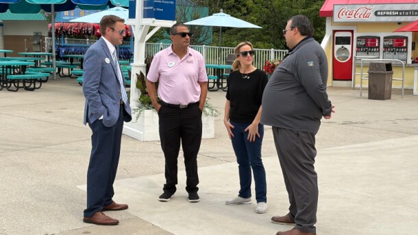(Right to left) State Representative Will Snyder and Secretary of State Jocelyn Benson meet with Enchanted Parks management at Michigan's Adventure.