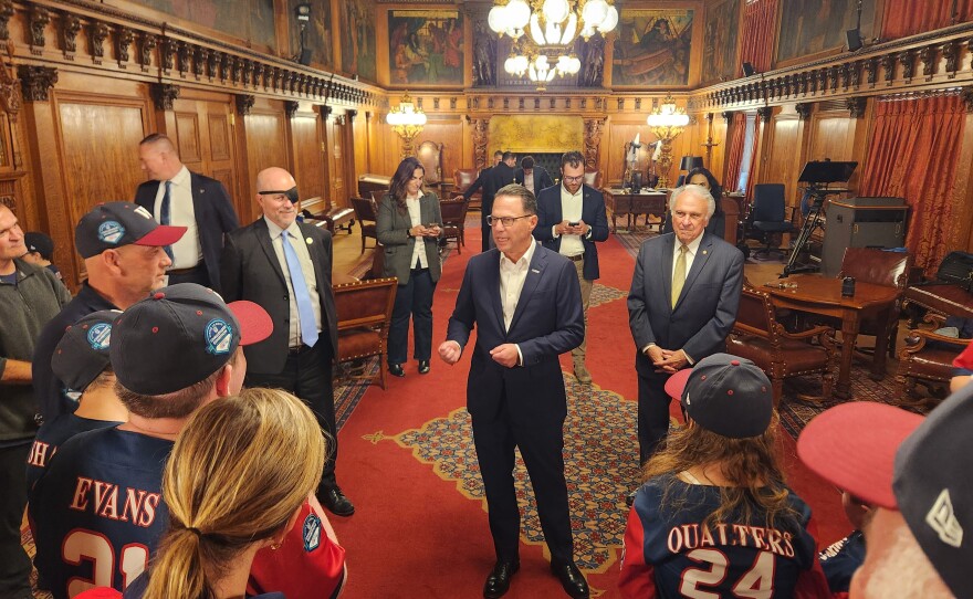 Gov. Josh Shapiro speaks with members of the Wyoming Valley Challenger baseball team.