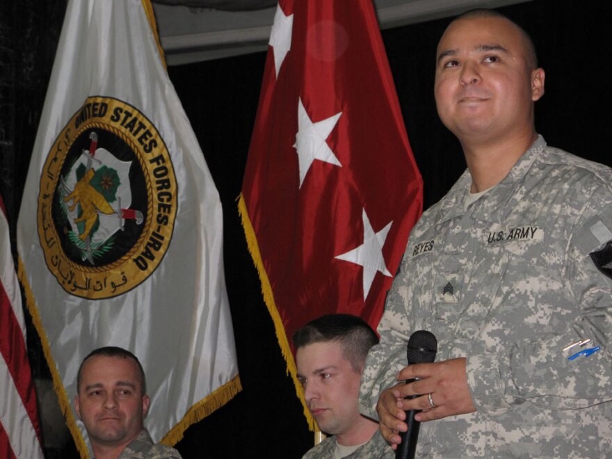 Retired Army Sgt. Alexander Reyes (right), from Miami, responds to applause at Camp Liberty in Baghdad after sharing the story of how he was wounded by an IED in 2007. He is one of seven wounded veterans who recently returned to Iraq as part of Operation Proper Exit, a program aimed at helping soldiers heal from traumatic injuries.