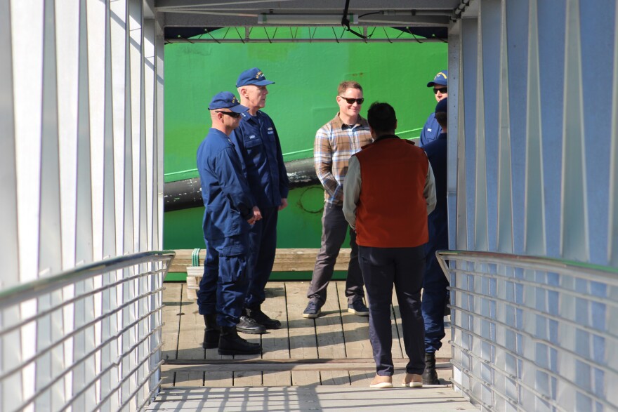 Master Chief Petty Officer of the Coast Guard Phillip Waldron (left) and 28th Commandant (COMMA-dant) of the U.S. Coast Guard Admiral Kevin Lunday stand near the future mooring point of two Coast Guard ships on Monday, Aug. 10, 2026 in Seward, Alaska.