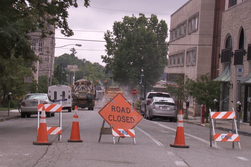 Crews work on the road at Kirkwood and Washington after a water main break caused flooding in July of 2019.