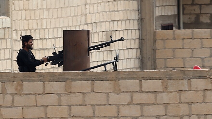 A Syrian rebel fighter in the northeastern Syrian border town of Ras al-Ayn on Nov. 11. The rebels and a Kurdish militia in the town both oppose President Bashar Assad's regime, but they have been fighting each other in recent days.