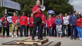 President Joe Biden, second from right, listens as United Auto Workers President Shawn Fain speaks. (Evan Vucci/AP)