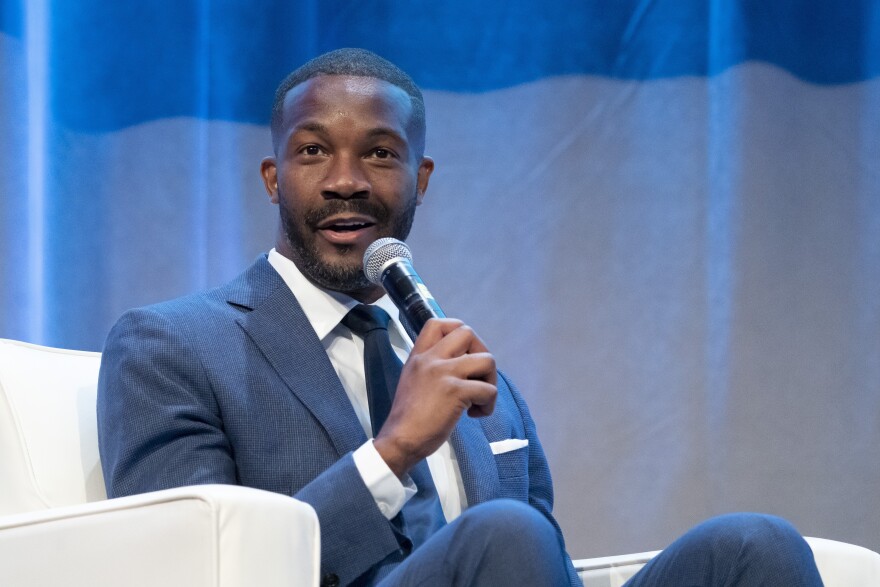 FILE - Birmingham, Ala., Mayor Randall Woodfin, moderates a conversation with Vice President Kamala Harris at the National Urban League Annual Conference, July 22, 2022, in Washington. (AP Photo/Alex Brandon, File)
