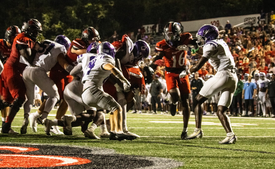 Junior running back Payton Brown drags a crowd of Central Arkansas defenders into the end-zone for a touchdown, Saturday, Sept. 19, 2026.