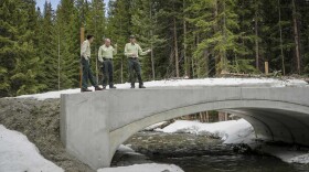 Forest Service Chief Tom Schultz, center, visits the Mizpah Campground on the Arapaho-Roosevelt National Forests on April 16. Some worry the current administration's plans could undermine wildfire preparedness.