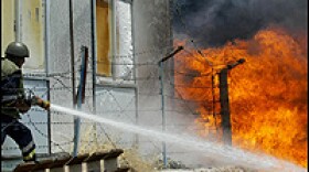 A Lebanese fireman douses fire at a factory after it was hit by an Israeli air strike in Bourj Shimali near Tyre.