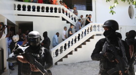 FILE - Colombians and Haitians who are accused of involvement in the 2021 assassination of Haitian President Jovenel Moise are escorted in handcuffs to their court hearing in Port-au-Prince, Haiti, May 26, 2025. (AP Photo/Odelyn Joseph, File)