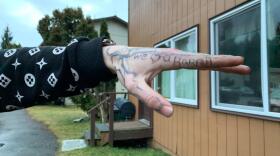 Residents and visitors at the Chinook apartment complex in the Mendenhall Valley show tattoos they were given by Kelly “Rabbit” Stephens on Dec. 29, 2019 in Juneau. Stephens was killed during an early-morning confrontation with Juneau police officer James Esbenshade. (Rashah McChesney/KTOO)
