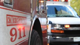This is an emergency scene including both a fire engine and an ambulance.