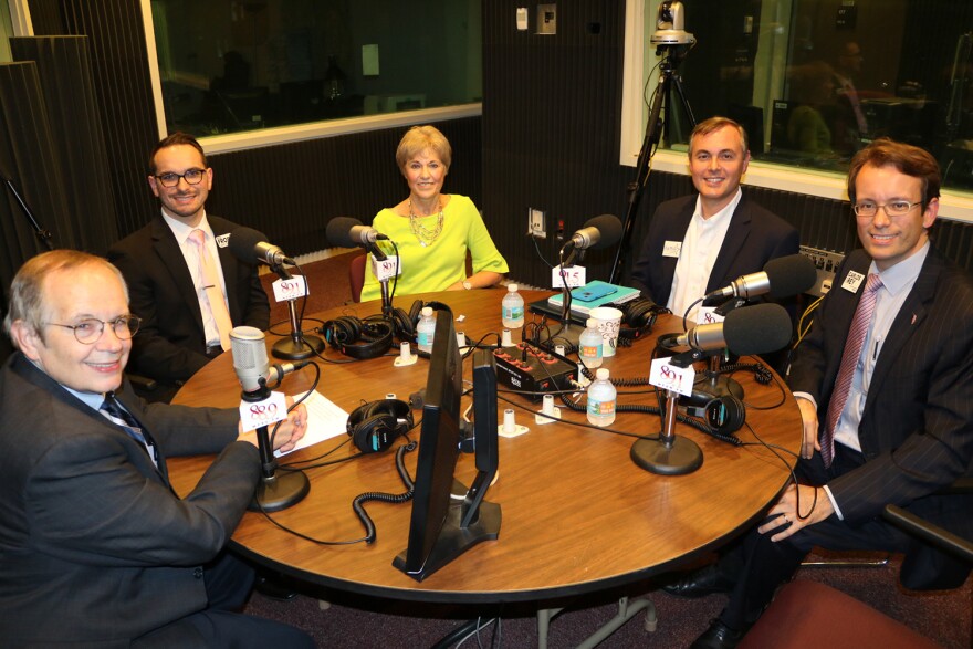 Leon County Commission District Three candidates and Tom Flanigan siting around the table in the studio