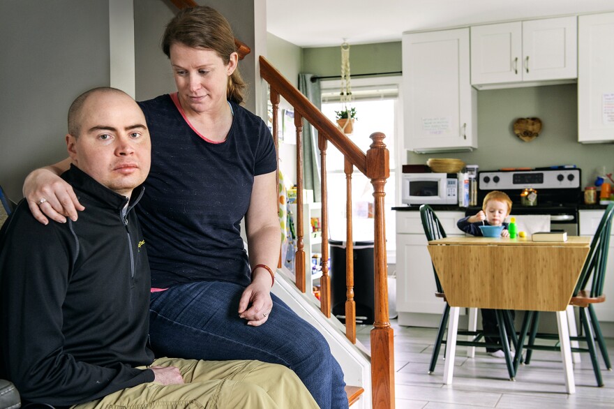 Army Veteran Peter Antioho with his wife, Amy and son, Mark in their Berlin home. Antioho was exposed to black smoke from an open burn pit in Afghanistan. He's fighting for federal disability benefits.