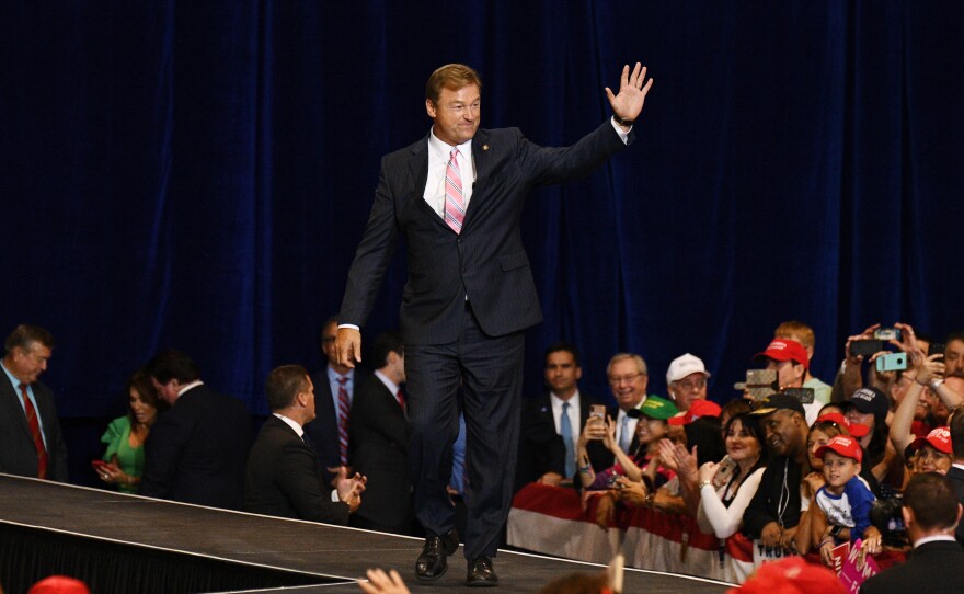 Dean Heller waves as he arrives at a rally with Trump (not pictured) in Las Vegas on Sept. 20. He is the only Republican in the Senate up for re-election in a state that Hillary Clinton won.