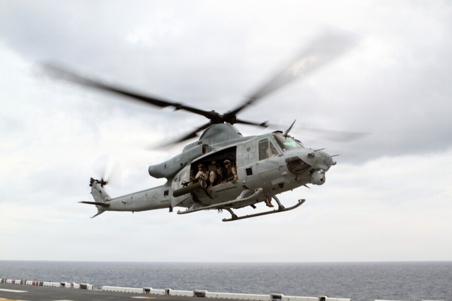 File: A UH-1Y Huey from Marine Medium Tiltrotor Squadron 365 (Reinforced), 24th Marine Expeditionary Unit, takes off from the USS Iwo Jima off the coast of North Carolina, August 9, 2014. The 24th MEU is currently taking part in Amphibious Squadron/Marine Expeditionary Unit Integration, or PMINT, the 24th MEU’s second major pre-deployment training exercise. PMINT is designed to bring Marines and Sailors from the 24th MEU and Amphibious Squadron 8 together for the first time aboard the ships of the Iwo Jima Amphibious Ready Group. (U.S. Marine Corps photo by Sgt. Devin Nichols) (Sgt. Devin Nichols)