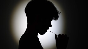 In this photo illustration, A teenager takes a home test on May 13, 2021 in Knutsford, England. (Christopher Furlong/Getty Images)