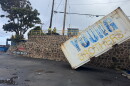 Hurricane Lowell caused significant infrastructure damage to Lānaʻi's harbor and carried away shipping containers, leaving some displaced on land and others across the harbor.