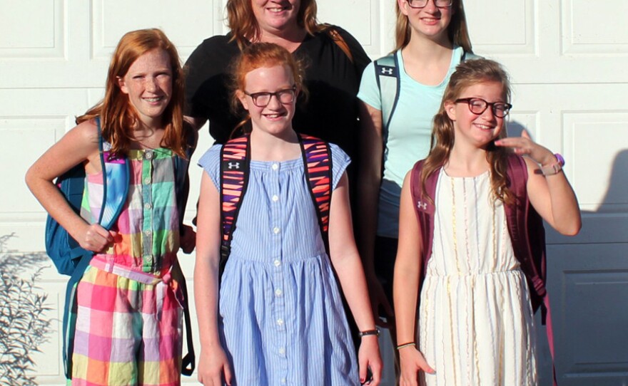Ami Pierce and her daughters pose for a portrait on their farm before heading to school. Clockwise from left: Julia Pierce, Ami Pierce, Frankie Pierce, Aubrie Pierce and Charlie Pierce.