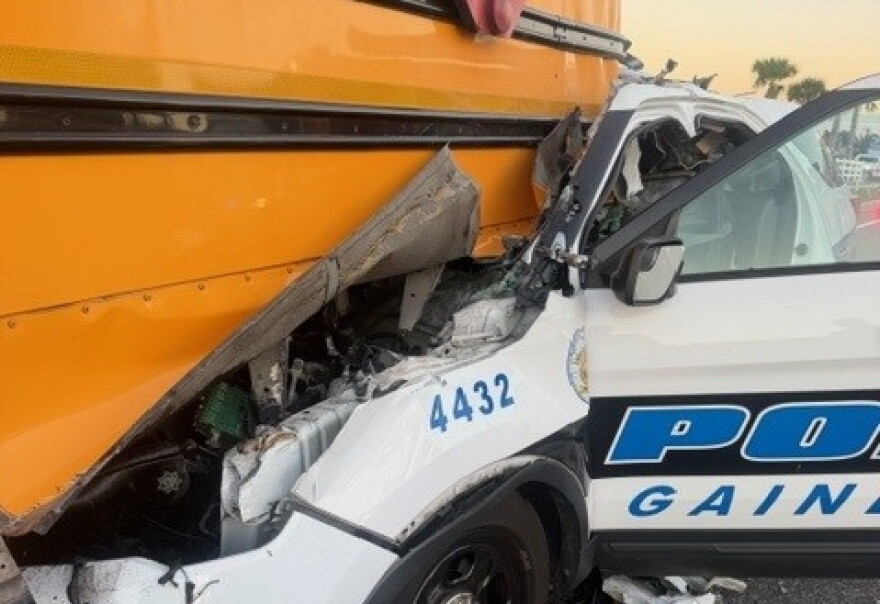 An off-duty Gainesville Police officer hit a school bus in Marion County Friday morning. Four were hurt in the accident.