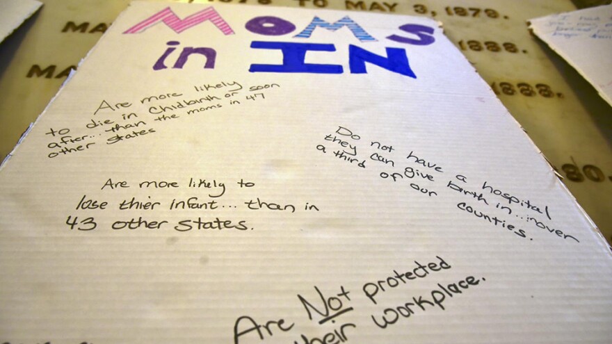 A poster advocating for better policies for women from a Hoosier Action statehouse rally during the 2021 legislative session.
