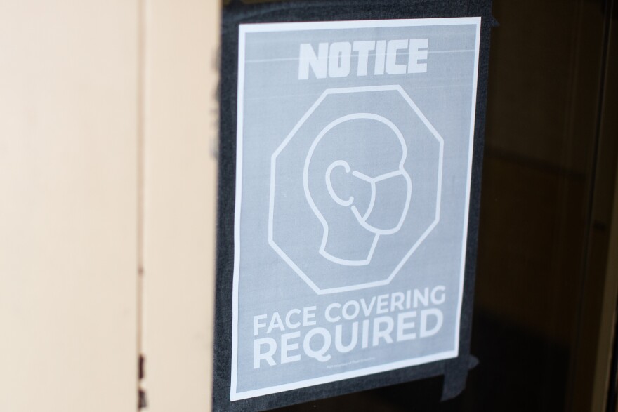 A sign at Galindo Elementary School in South Austin reminds people that face coverings are required.