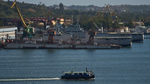 A ferry boat navigates across Havana Bay as it passes Cuban coast guard ships docked at the port as it leaves Casablanca, Cuba, Thursday, Feb. 26, 2026.