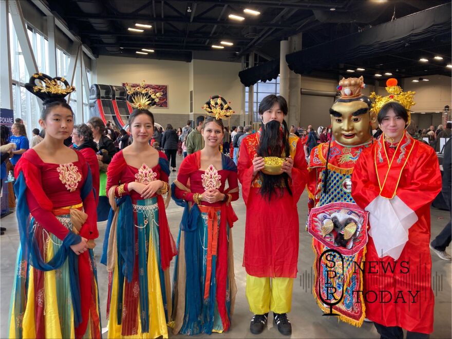 Local students dress up as Chinese princesses and money gods to celebrate Lunar New Year at the Spokane Convention Center.