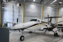 The University of Wyoming’s King Air research aircraft sits in a hangar at the Salt Lake City International Airport, Aug. 3, 2026. The plane must be constantly hooked up to air conditioning when not in flight to keep sensitive instruments and computers cool enough to operate properly.