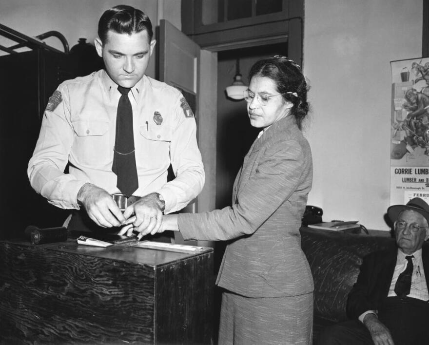 Rosa Parks, is fingerprinted by police Lt. D.H. Lackey in Montgomery, Ala., Feb. 22, 1956. She was among some 100 people charged with violating segregation laws. Parks refused to move to the back of a bus two months earlier on Dec 1, 1955. (Gene Herrick/AP)