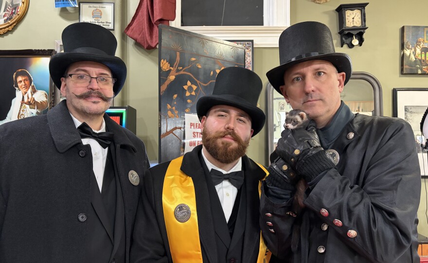 Founding fathers Mike McAndrew, Matt Catanzaro and Jim Salus pose with Jessup Giuseppe at Three Saints Barber Shop.