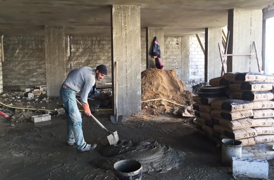 Radwan Mahmoud, a Syrian refugee, works as a laborer on a construction site in Lebanon. He's supporting 12 family members and earning about $16 a day. With a population of just over 4 million, Lebanon is host to more than 1 million Syrian refugees.