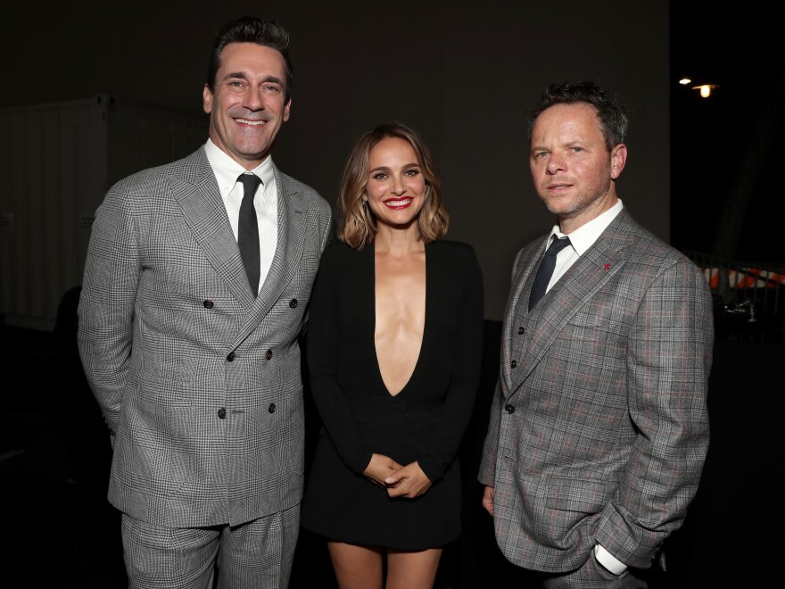 <em>Lucy in the Sky </em>stars Jon Hamm and Natalie Portman pose with director Noah Hawley at the movie's Los Angeles premiere.