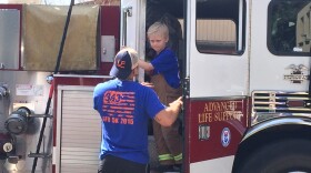 Riley getting out of the newer fire engine.