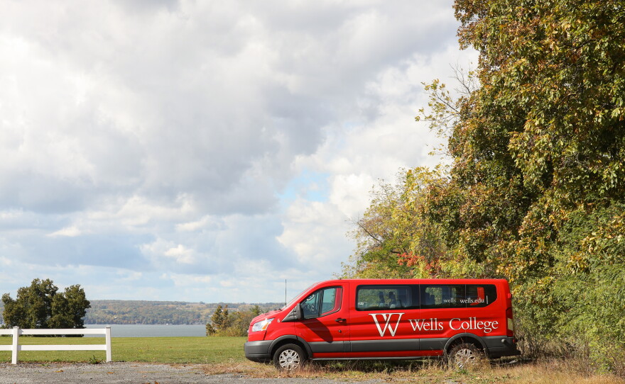Wells College vans parked at top the field hockey field over looking Cayuga Lake at the former Wells College campus in the village of Aurora, New York. Wells College has received court approval to sell and transfer artwork, artifacts, rare books and other personal property as it continues to wind down operations after its June 2024 closure. The future of the campus remains unresolved after a proposed $12.5 million sale fell through earlier this year.