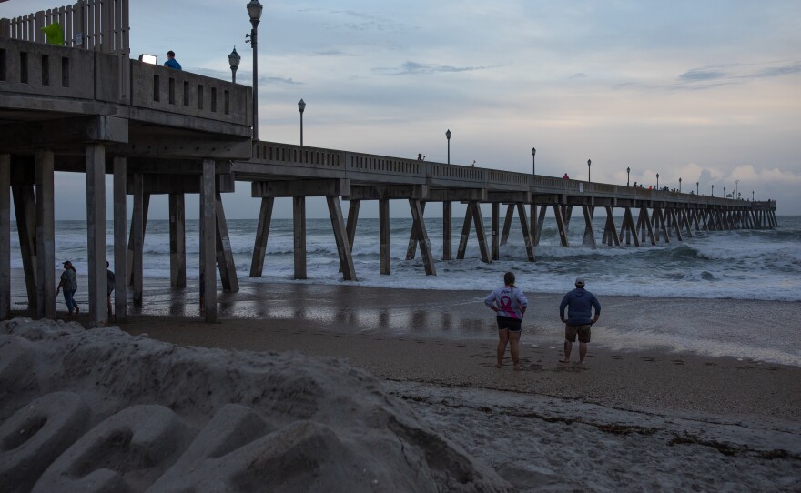 Larger than normal waves caused by Hurricane Erin crash against Johnnie Mercers Fishing Pier in Wrightsville Beach, North Carolina on August 20 2025.