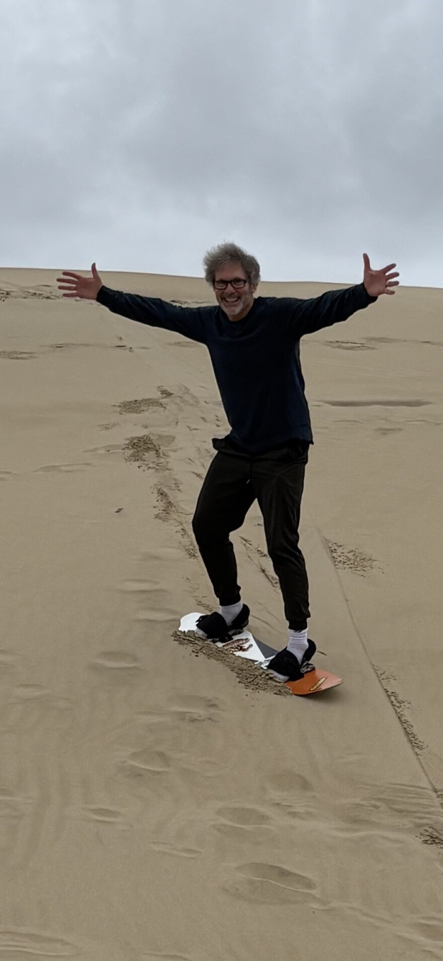 The host on his first successful sand surf run.